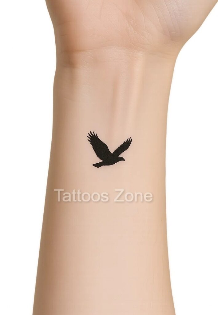 Minimalist eagle tattoo on wrist